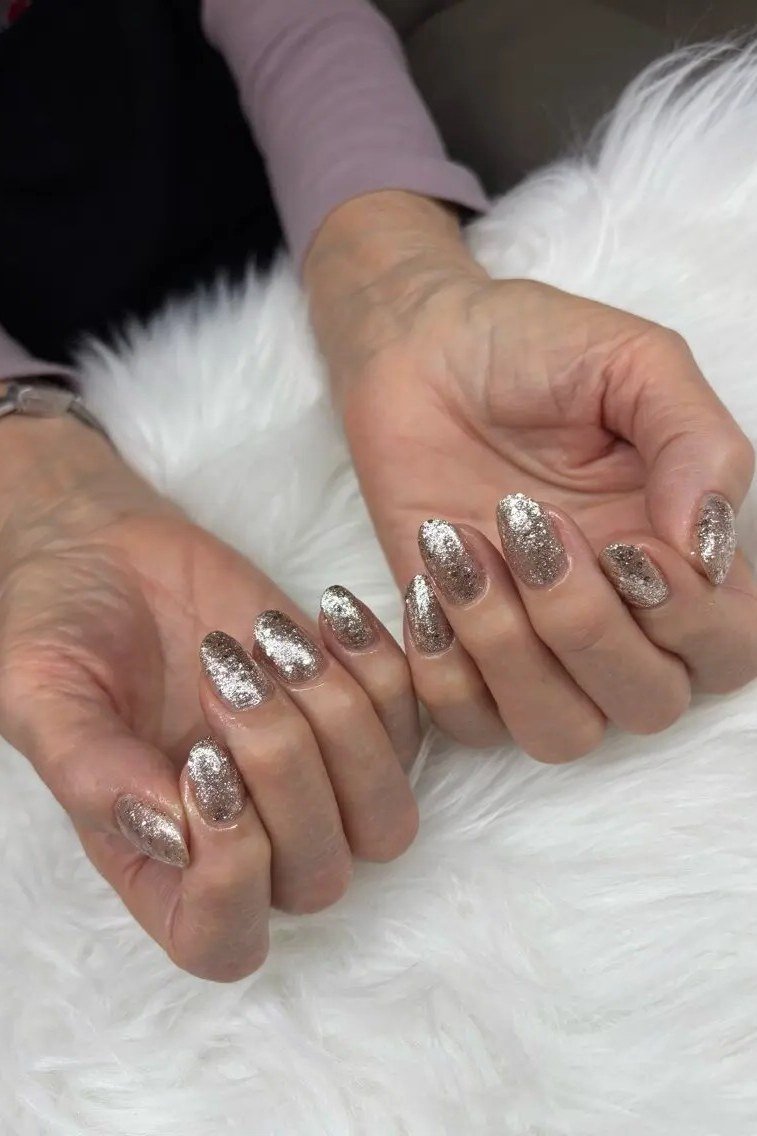 Silver Glitter Almond Nails in White Fur - winter nail trend for older women over 70