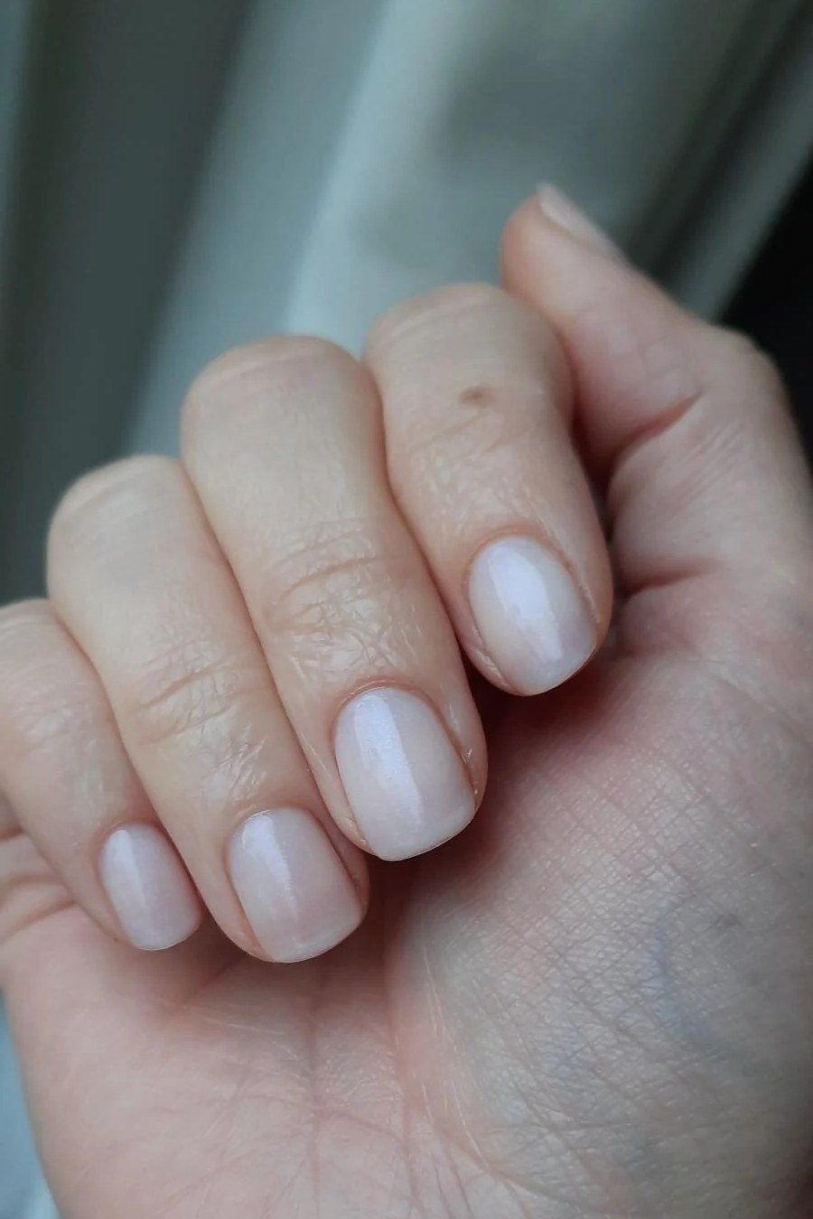 Pale Milky White Nude - short nude nail idea for women over 50