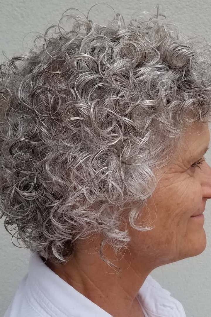 Graduated gray curly bob side view for older women