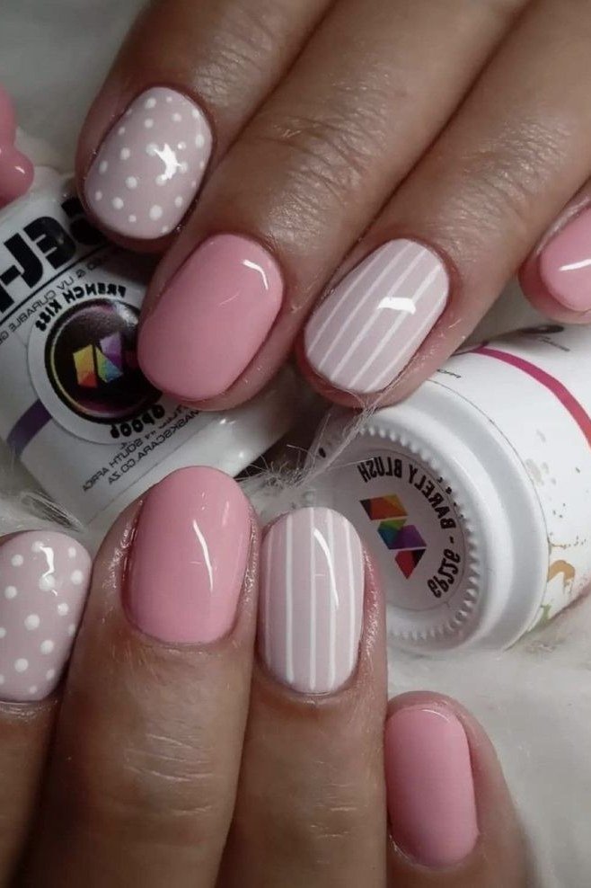 Pink Gel Nails with Stripes and Dots - short gel nail idea for women over 50