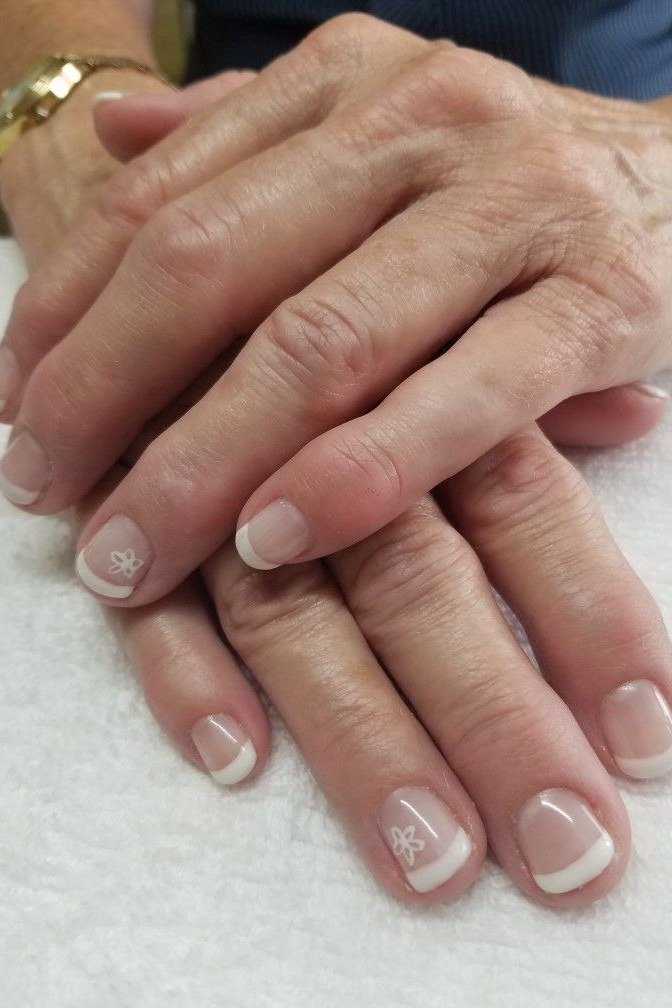 Beige French with White Floral Art, neutral nail ideas for older women