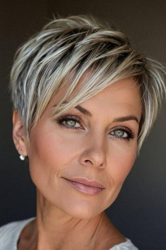 Silver pixie with side swept bangs for women over 60, front view