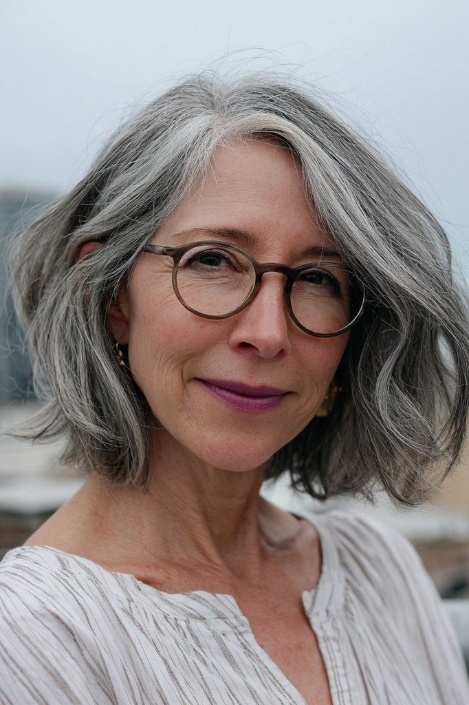 Wavy Grey Shoulder Hair with Glasses - grey hairstyle for women over 60