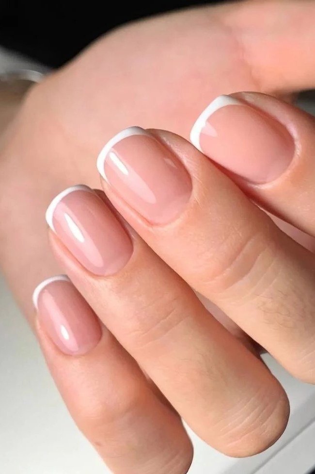 Micro french nails close-up, sophisticated nail design for women over 50