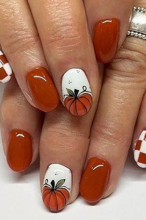 Rust with pumpkin and gingham art oval, elegant fall nail design for women over 40