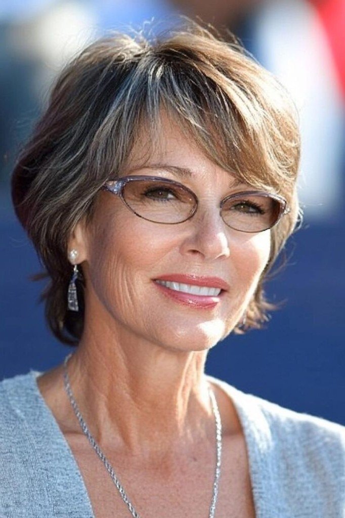 brown-grey bob with glasses, front view — chin-length layered bob hairstyle for women over 50