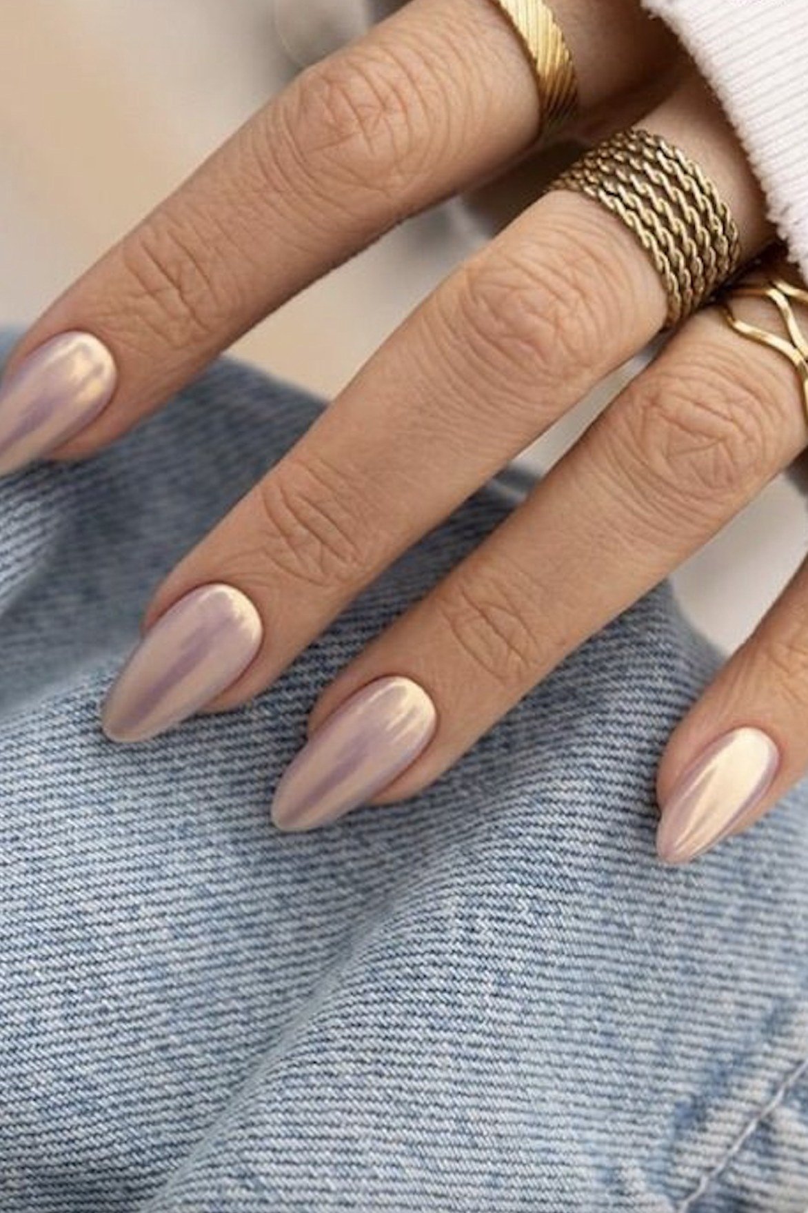 Neutral taupe almond nails with a glossy finish, simple elegant fall neutral.