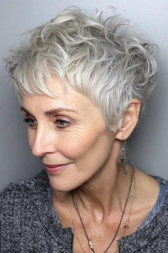 Spiky gray curly pixie haircut for women over 50