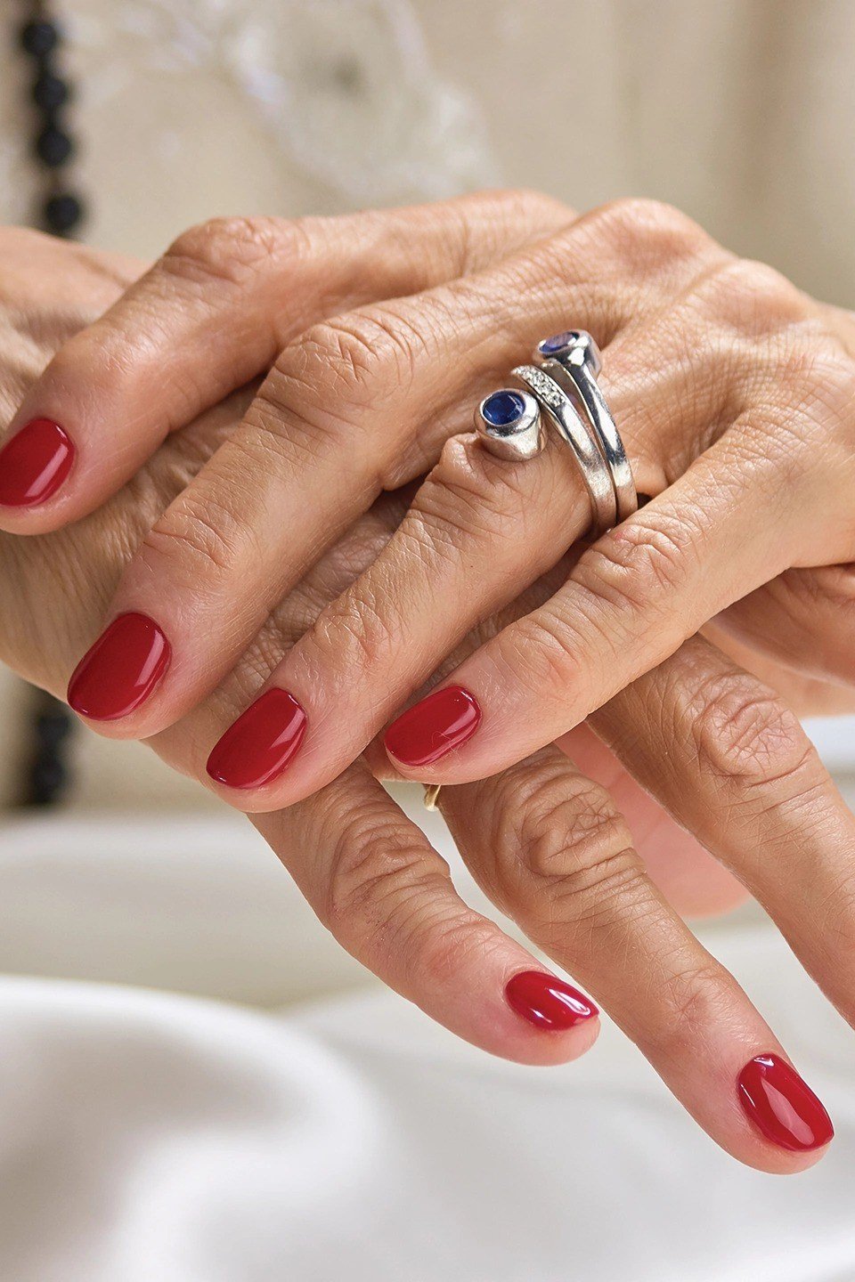 Red Nails with Gemstone Rings, fall nail color idea for women over 50
