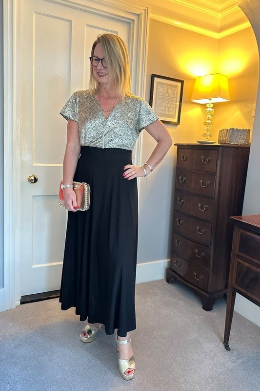 Silver sequin top, black maxi skirt, home interior, chic night out outfit for women over 50