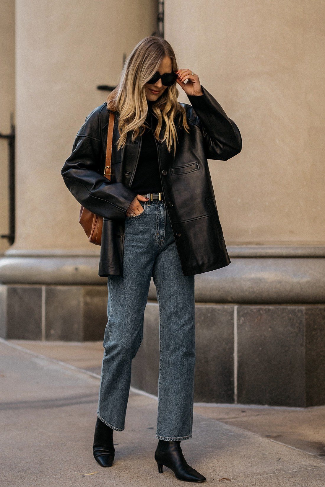 Black jacket with jeans and ankle boots fall outfit idea for women over 60