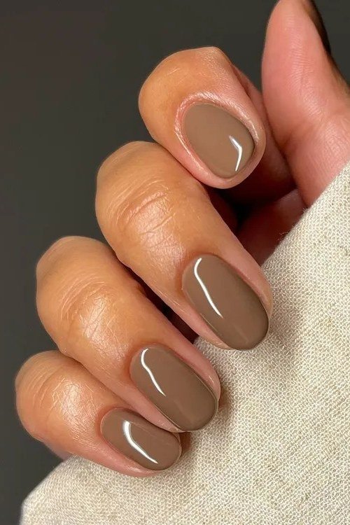 Warm taupe oval nails glossy