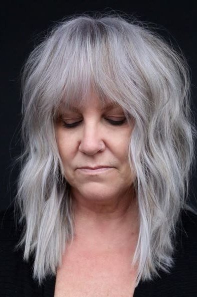 long silver layers with bangs, front view, medium length hairstyle for women over 60