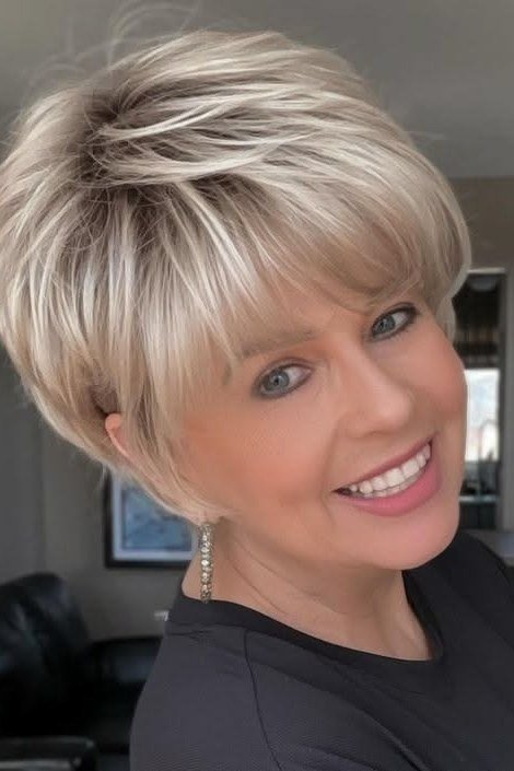 Layered blonde bob haircut for women over 70, three quarter view