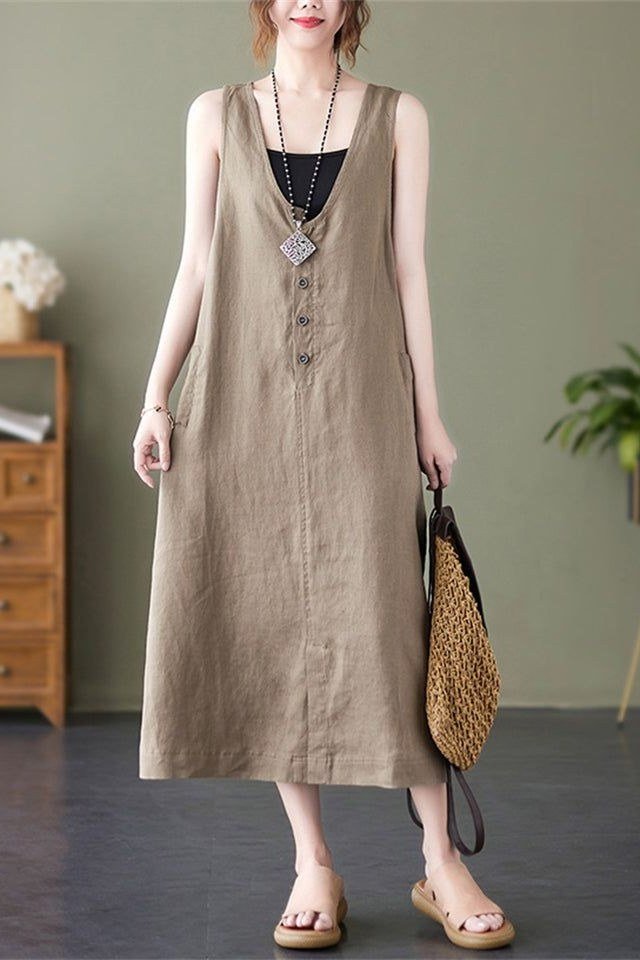 Taupe sleeveless v-neck maxi dress with straw tote, interior for women over 60