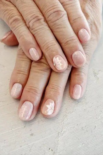 Blush glitter accent nail sparkle - flattering nail design for older women