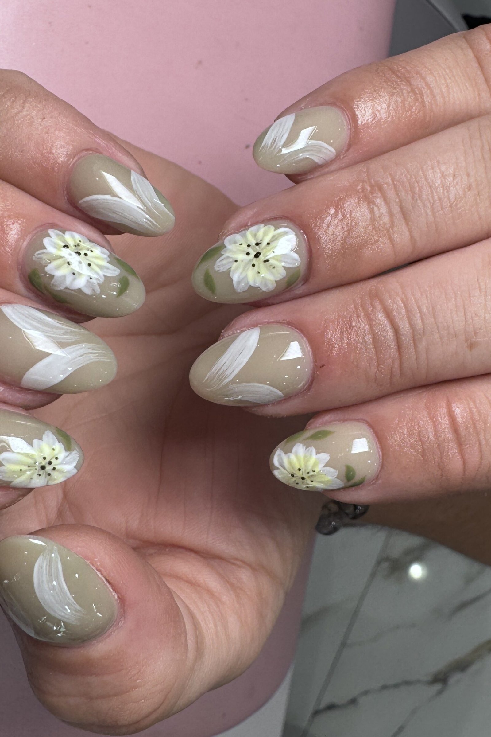 Nail art design for women over 60: sage green nails with daisy art
