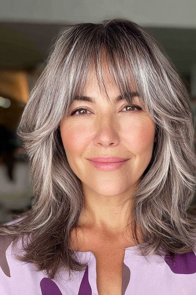 Silver-Grey Butterfly Cut with Bangs - butterfly cut hairstyle for women over 60