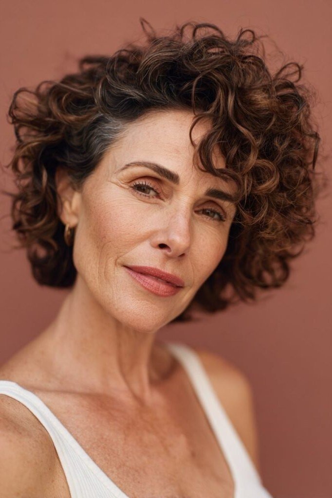 Rich brown curly lob, front view, mature woman