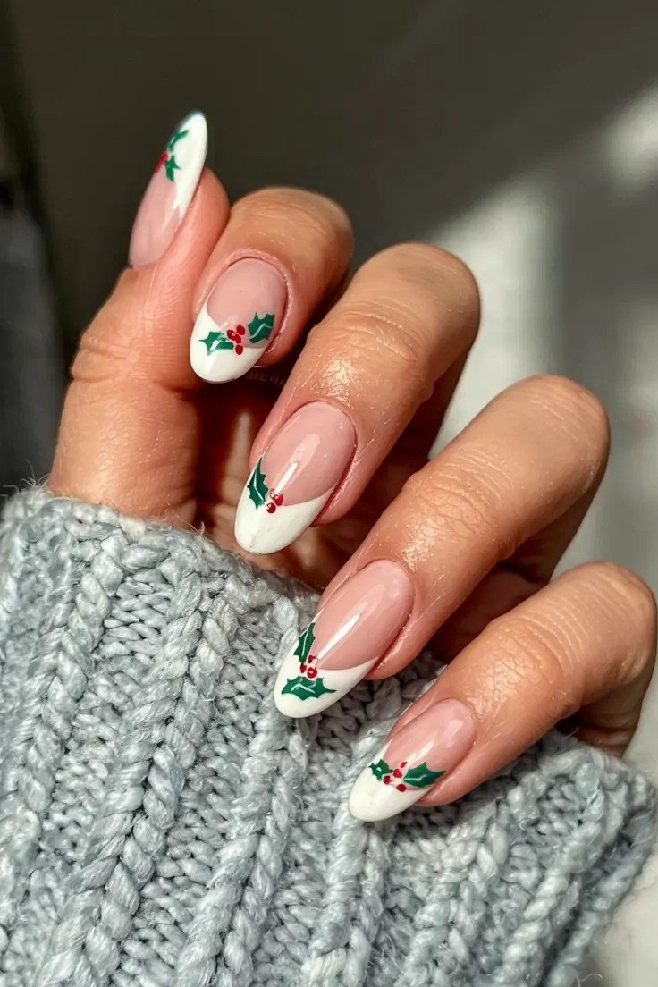 White French tips with green holly art - classy Christmas nail idea for women over 70