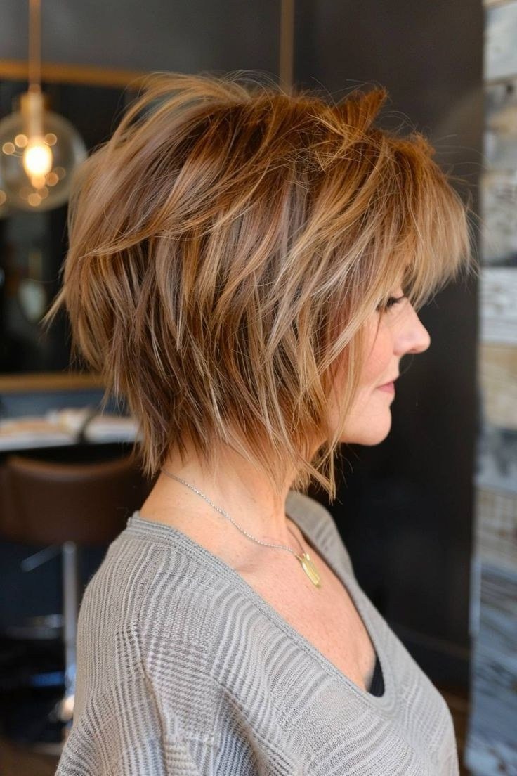 Copper Shaggy Bob - trendy layered bob hairstyle for women over 50