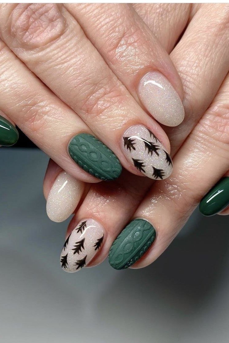 forest green with tree art, white sweater