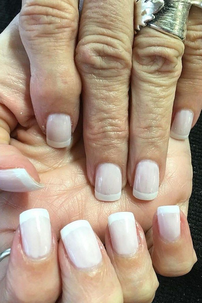 Short French manicure on both hands