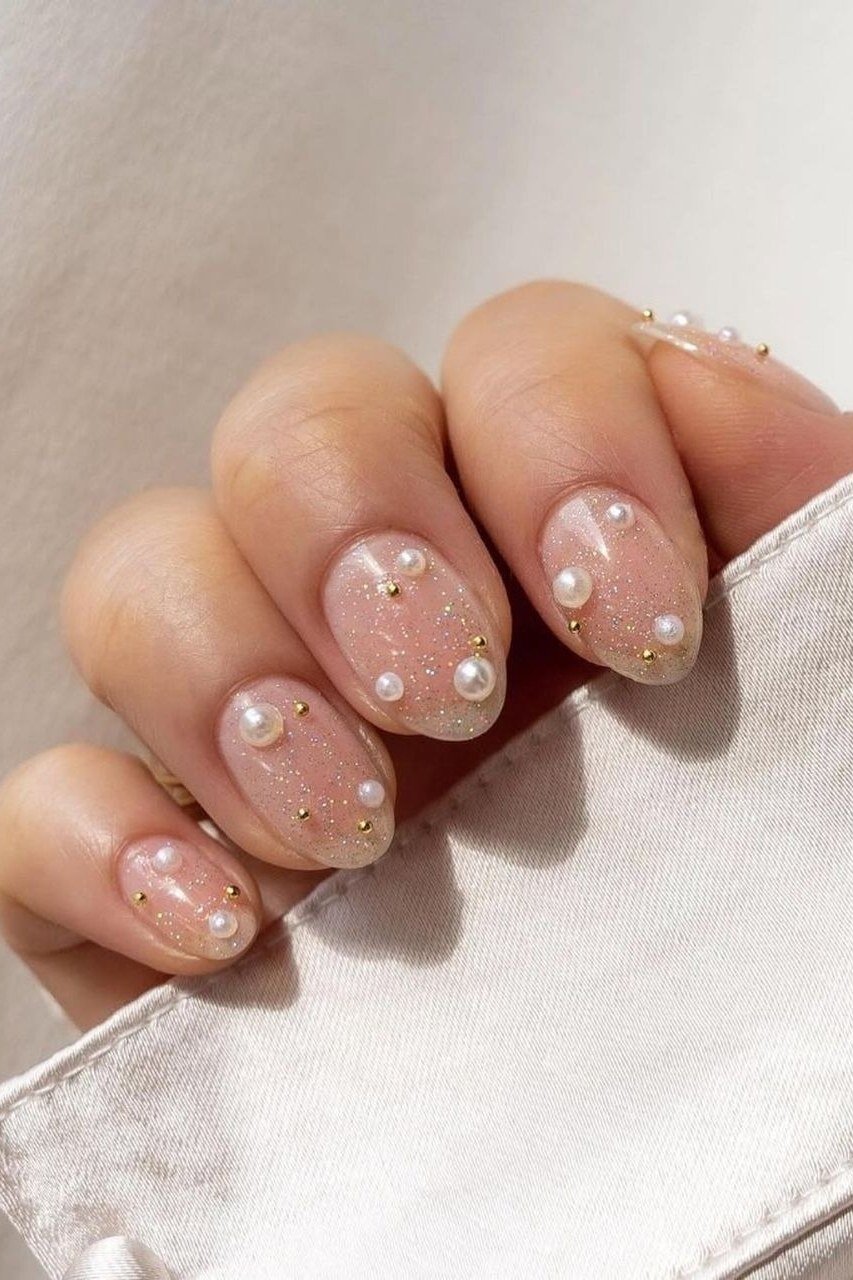 taupe short nails with pearl dot accents