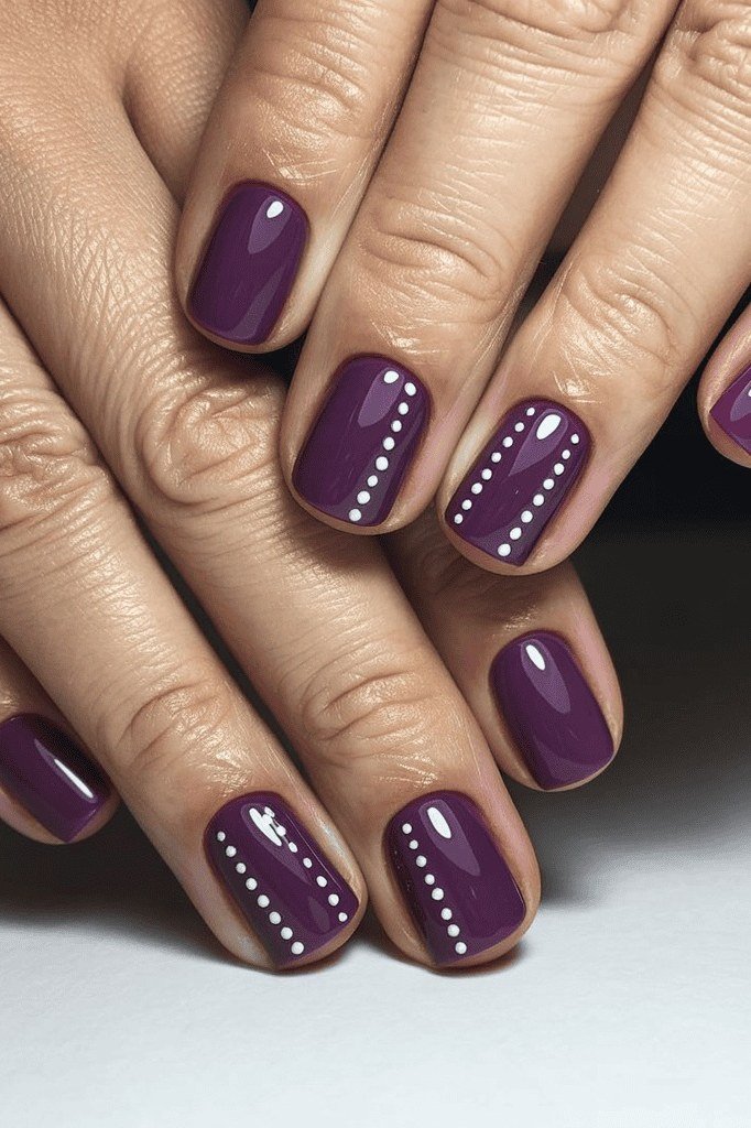 dark purple with white dot nail art - winter nail trend for older women