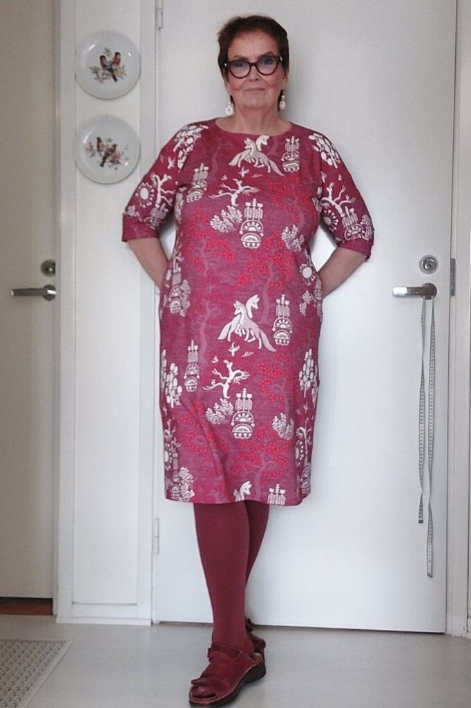 pink floral midi dress with red tights for women over 60