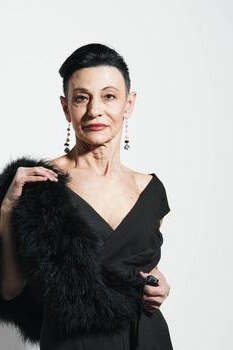 Black V-neck dress with feather stole for women over 50