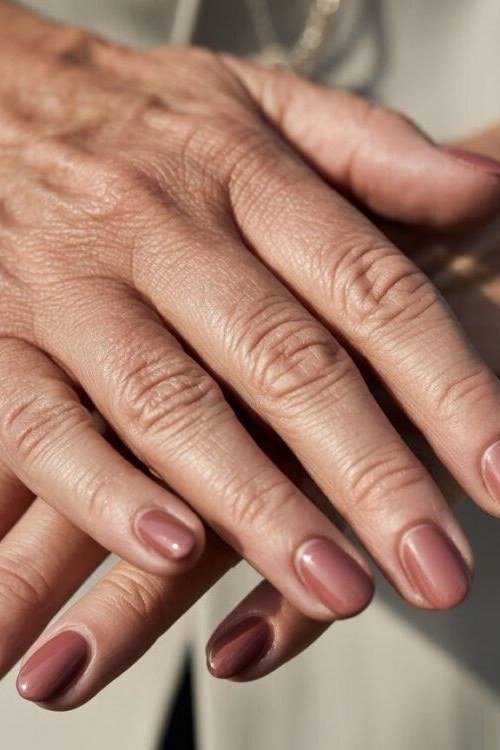 warm mauve oval gel nails, dusty rose nail color for older women
