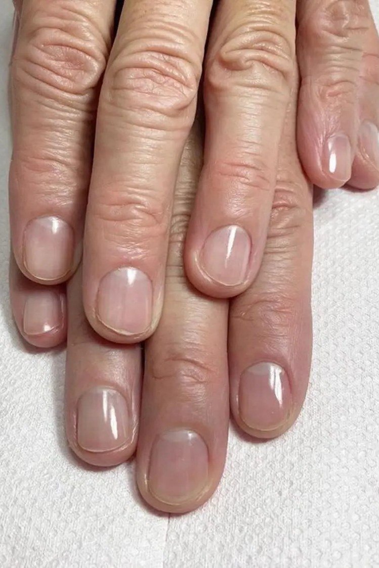 Sheer Pink on Older Hands - short nude nail idea for women over 50