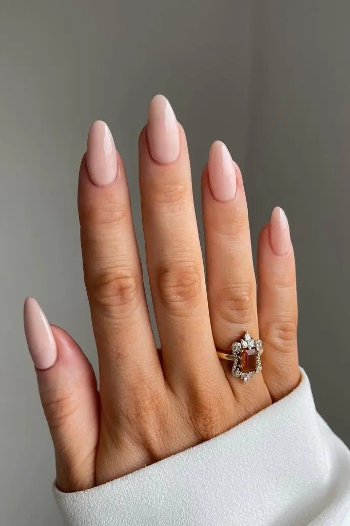 Almond Nudes with a Ring - nude nail art idea for women over 40