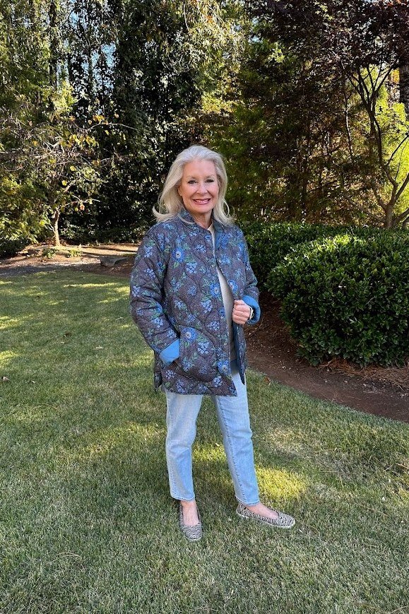 Green Quilted Jacket with a White Tee and Jeans on a woman over 50, fall outfit idea