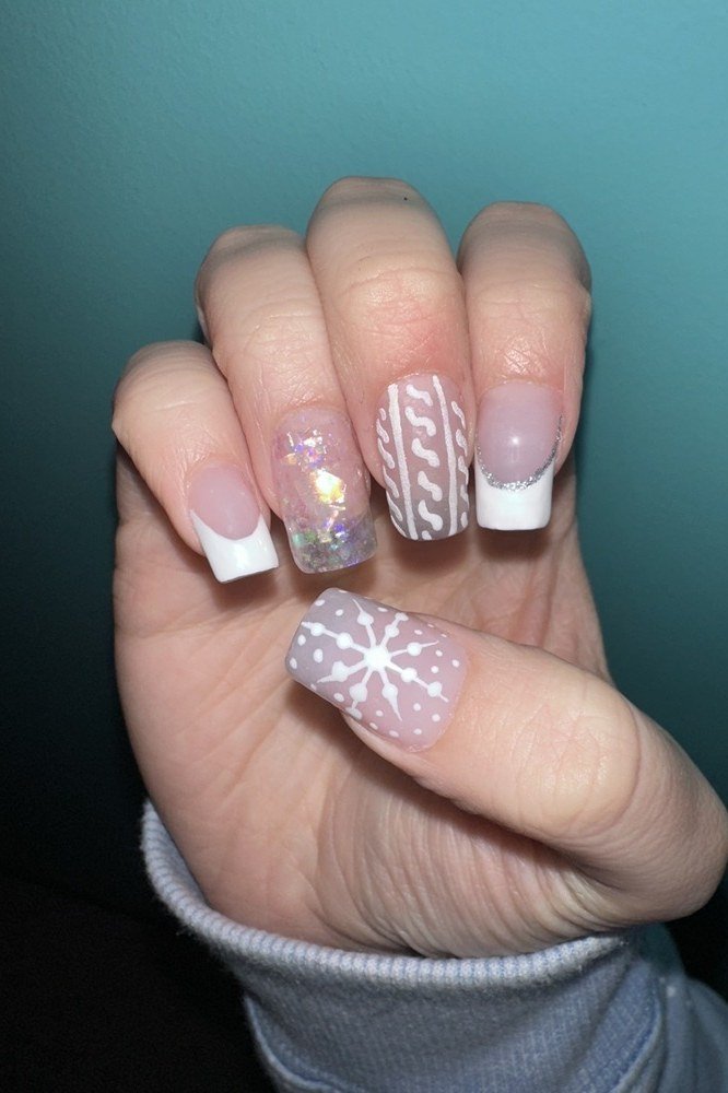 White nails with snowflake art - classy Christmas nail idea for women over 70