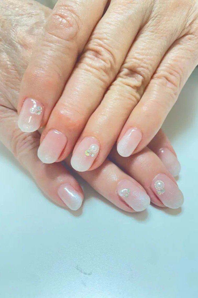 White glitter ombre gel nails for mature hands