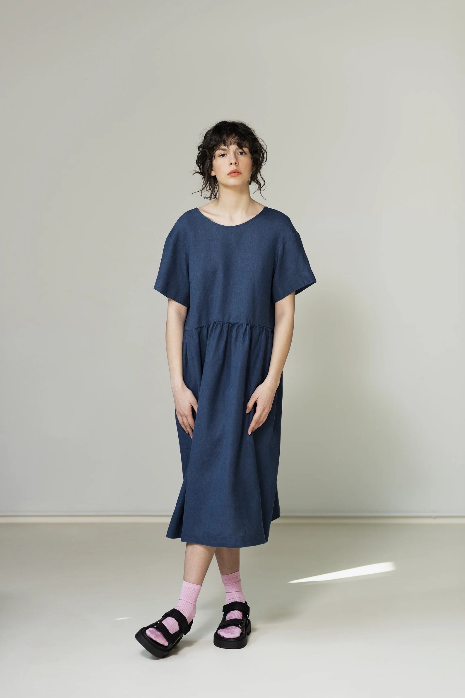 Navy tunic midi dress with black sandals, studio for women over 60
