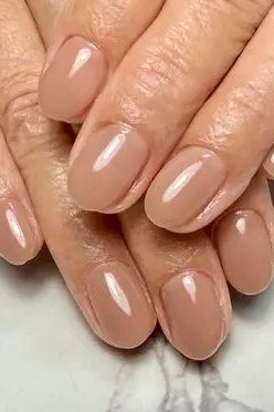 taupe nude oval gel nails, balanced neutral nail color for mature hands