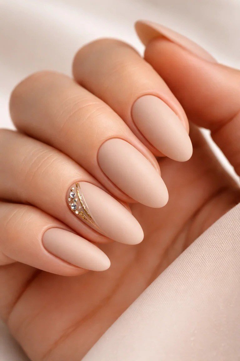 Nude Almond with Gold Chain Accent - elegant nude nail design for women over 60
