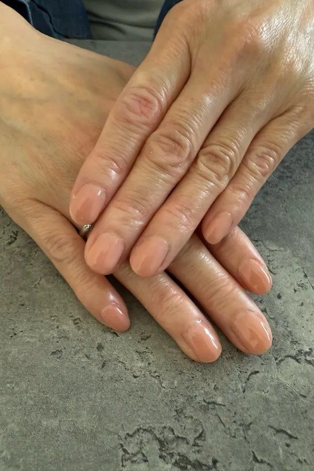 Pale Nude on Dark Stone - short nude nail idea for women over 50