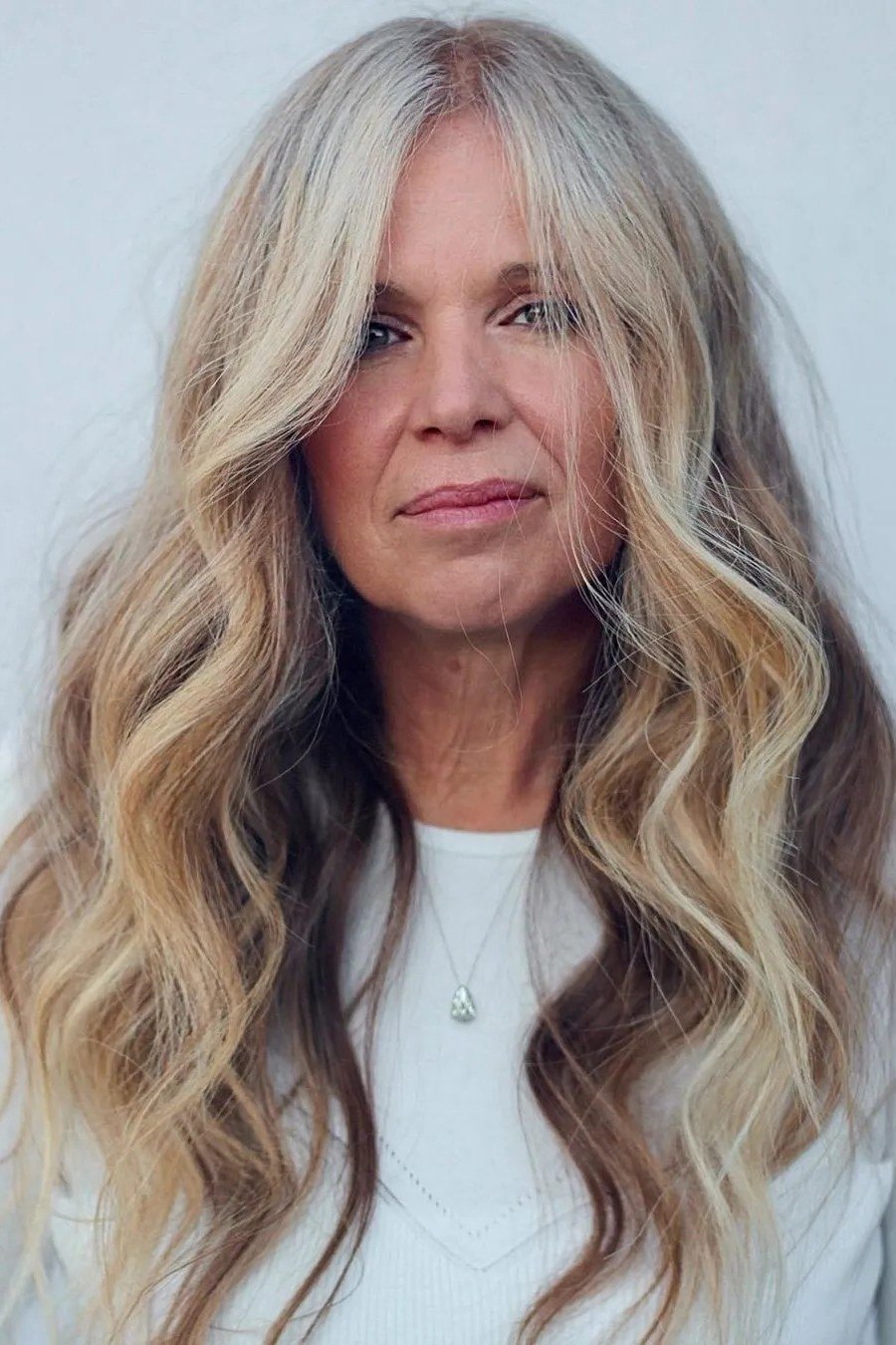 Long gray-blonde beach waves for women over 50