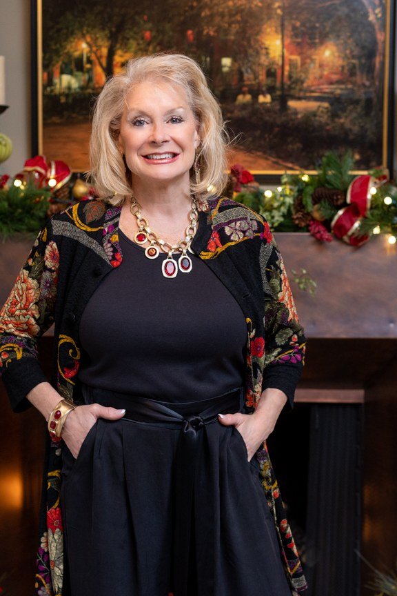 holiday evening outfit for women over 60: black jumpsuit with brocade duster coat
