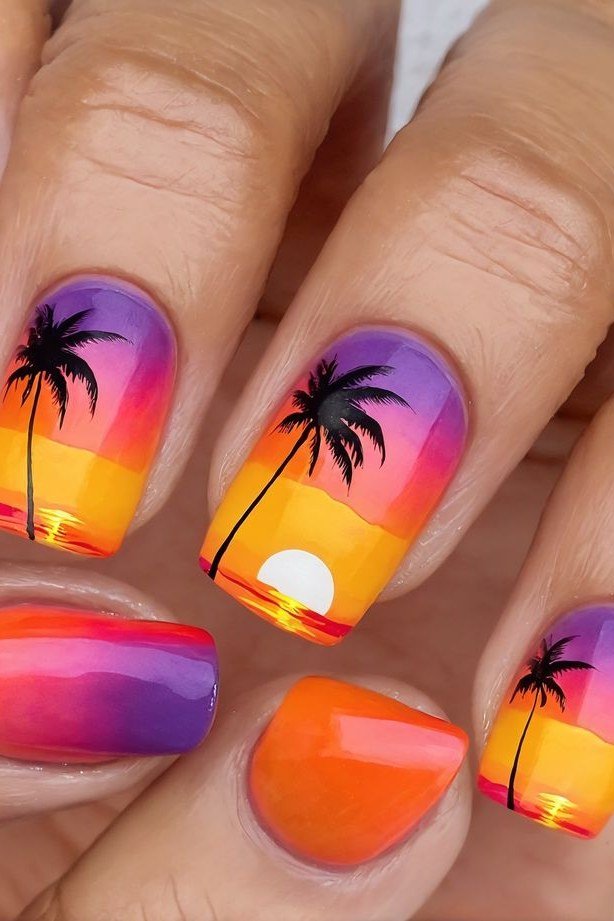 Purple Orange Sunset Palm Almond Nails - Violet purple melts into fiery orange on these medium almond nails, with black palm trees and a glowing sun painted over the blend. The glossy finish makes the scene vivid.