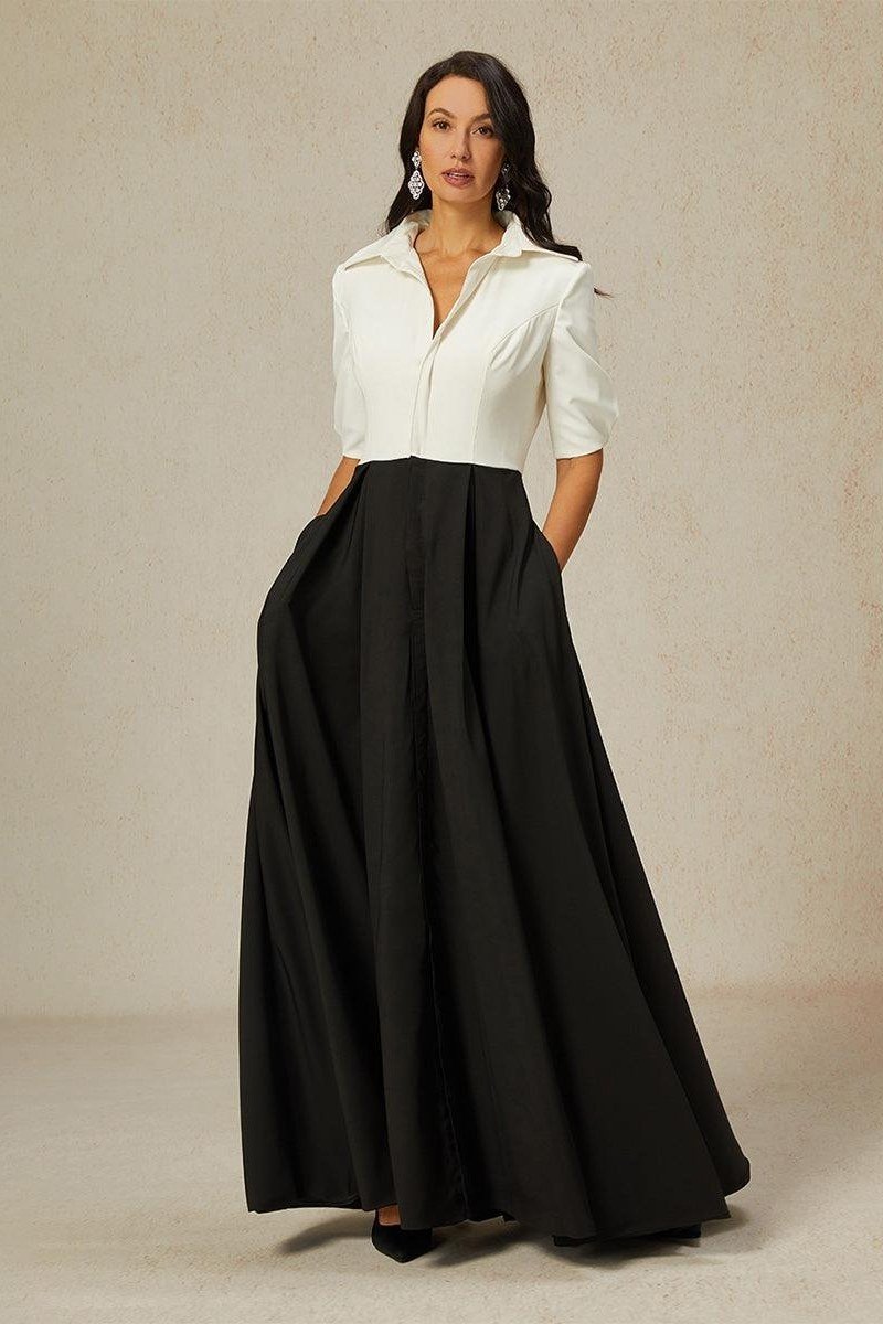 Woman in white blouse with black palazzo maxi skirt
