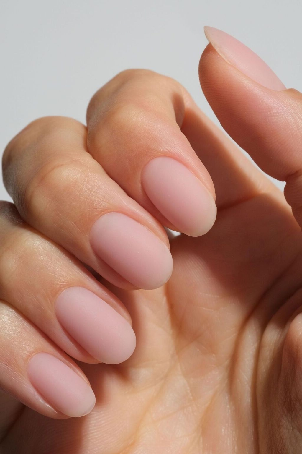 Matte Dusty Pink Short Oval - elegant nude nail design for women over 60