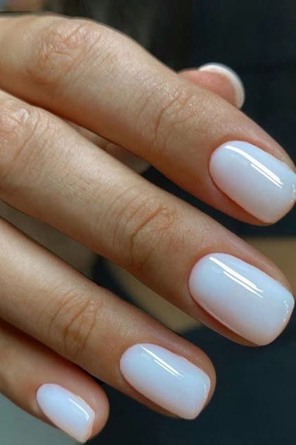 Short nails with chrome finish over milky white