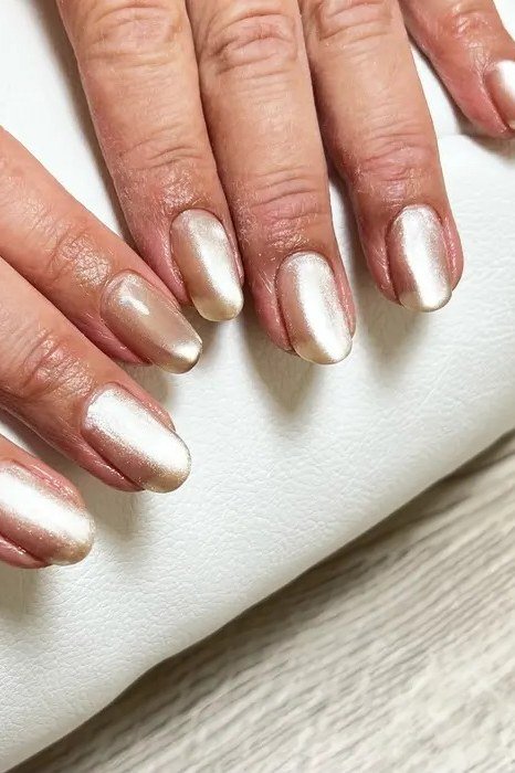 Gold Chrome Oval Nails - winter nail trend for older women over 70