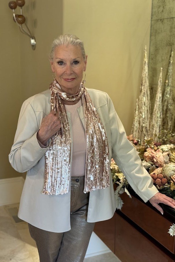 holiday evening outfit for women over 60: beige blazer with gold sequin scarf