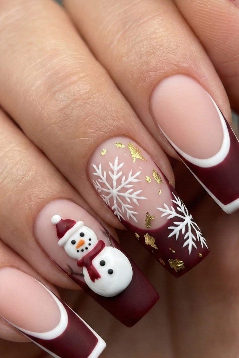 Burgundy French tips with snowflake and snowman art - classy Christmas nail idea for women over 70